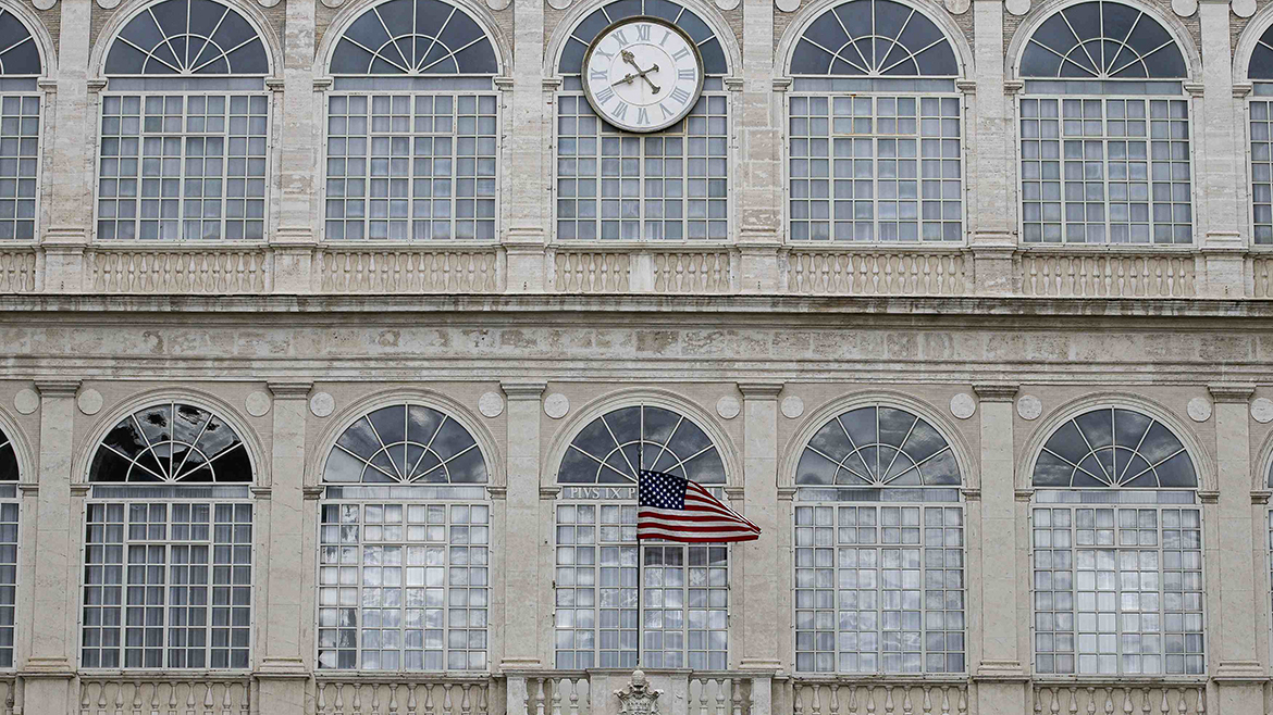 The U.S. national flag waves at the Apostolic palace as U.S. President Barack Obama attends a private audience with Pope Francis at the Vatican