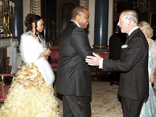 Britain's Prince Charles greets Swaziland's King Mswati III and his wife Inkhosikati LaMbikiza as they arrive for a dinner at Buckingham Palace in London