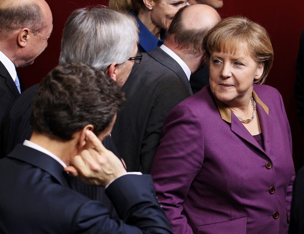 France's President Sarkozy Luxembourg's Prime Minister Juncker and Germany's Chancellor Merkel attend a family photo session during an European Union summit in Brussels