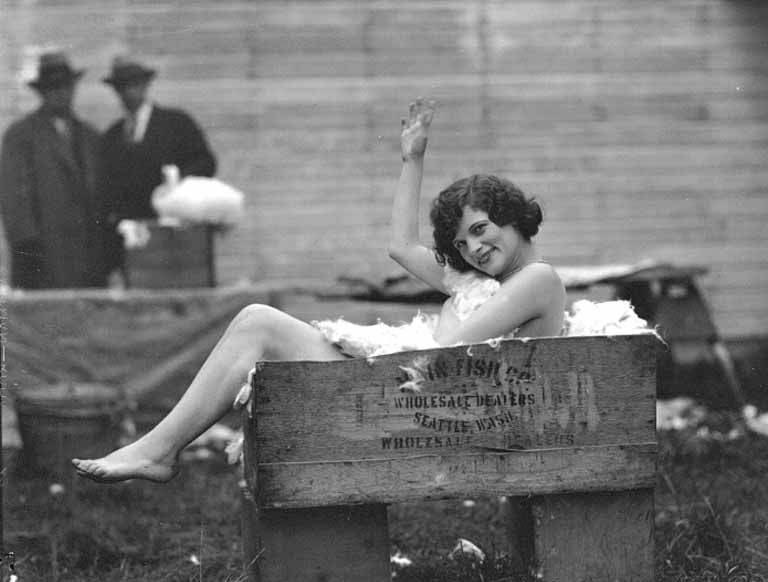 summer vintage bygone days past women in box full of feathers