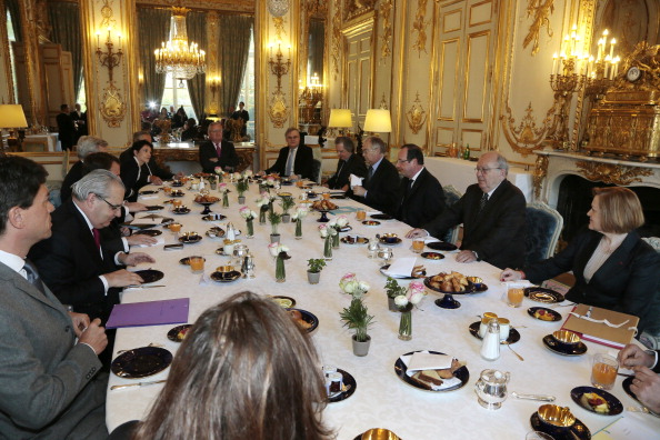 French President Francois Hollande (3R) attends a breakfast meeting with scholars and specialists of Franco-Chinese relations at the Elysee Palace in Paris on April 22, 2013. AFP PHOTO/POOL/JACQUES DEMARTHON (Photo credit should read JACQUES DEMARTHON/AFP/Getty Images)