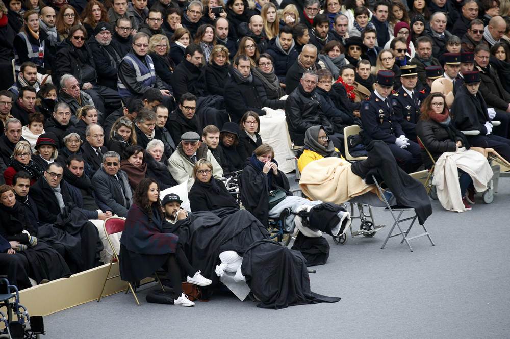 People wounded in the Paris attacks and family members attend a ceremony to pay a national homage to the victims of the Paris attacks at Les Invalides monument in Paris, France, November 27, 2015.            REUTERS/Charles Platiau  TPX IMAGES OF THE DAY